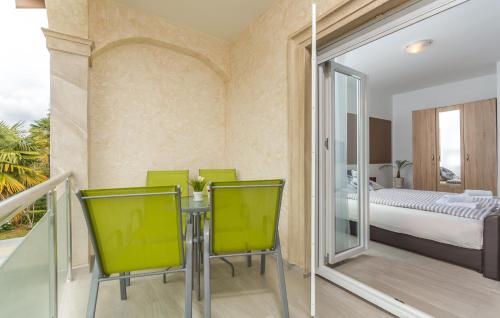 a room with a table and chairs and a bedroom at Villa Stephany in Poreč