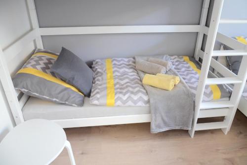 a white bunk bed with pillows on it at Hostel Bratislava in Bratislava