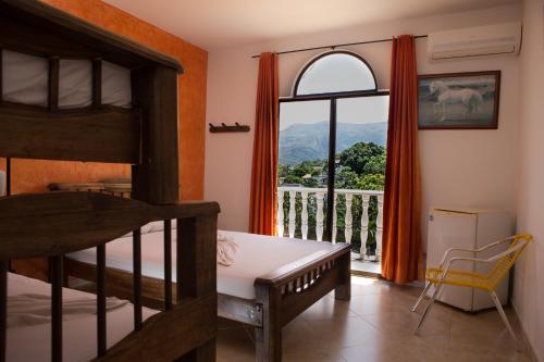 Postel nebo postele na pokoji v ubytování Hotel Anamichu Suites
