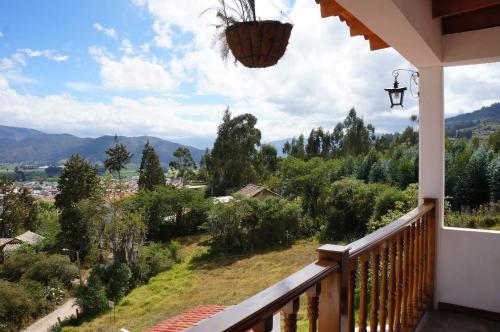 a balcony with a view of the mountains at San Benito Hotel in Tibasosa
