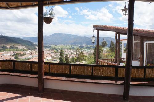 a balcony with a view of a city at San Benito Hotel in Tibasosa