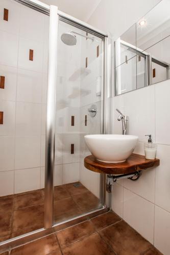 a bathroom with a sink and a shower at Old Town Square Apartment in Prague
