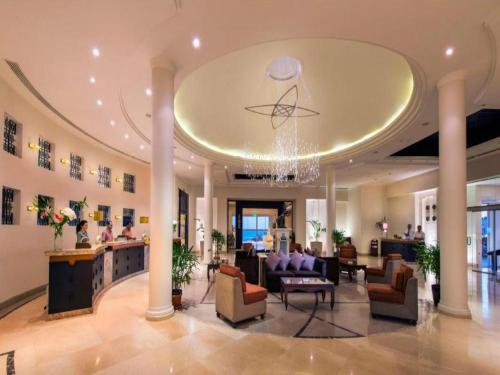 a lobby of a hotel with couches and chairs at Concorde El Salam Sharm El Sheikh Front Hotel in Sharm El Sheikh