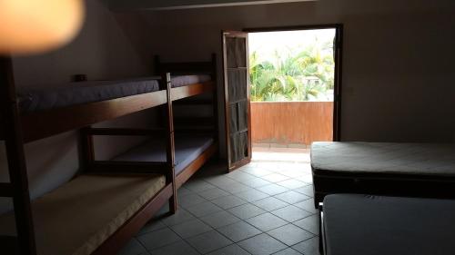 Una cama o camas en una habitación de Pousada Familiar Morada do Rapha