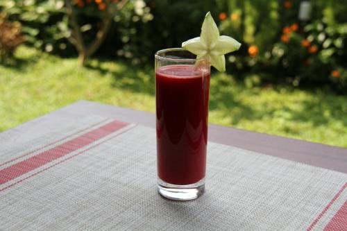 a drink in a glass sitting on a table at Coza Ceylon in Mount Lavinia
