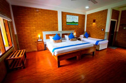 Tempat tidur dalam kamar di Elephas Resort & Spa