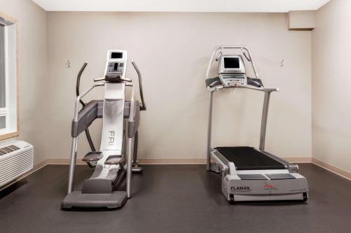 a room with two machines in a room at Super 8 by Wyndham Prince Albert in Prince Albert