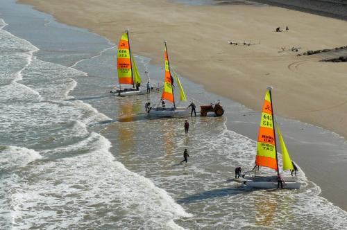 three sailboats in the water on a beach at Luxury Seaside Family house in Pléneuf Val André in Pléneuf-Val-André