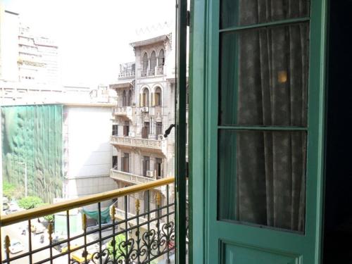 an open window with a view of a building at Berlin Hotel in Cairo
