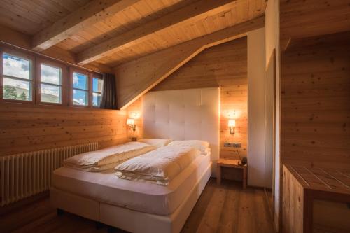 Un pat sau paturi într-o cameră la Hotel Costabella