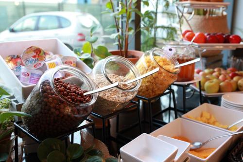a display of food in containers on a table at Rest Apartments in Wrocław