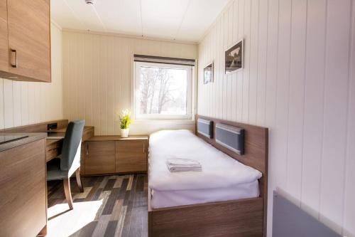 A bed or beds in a room at Horten Apartment