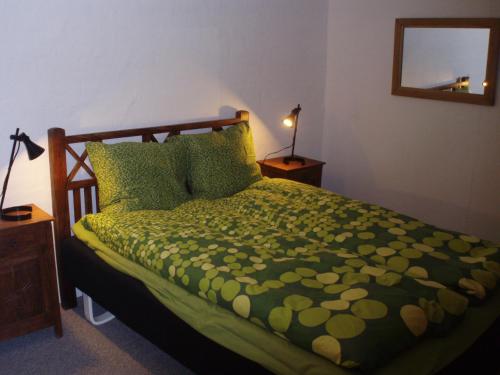 En eller flere senge i et værelse på Klitgaards Holiday Apartment