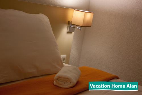 Ένα ή περισσότερα κρεβάτια σε δωμάτιο στο Vacation home Alan