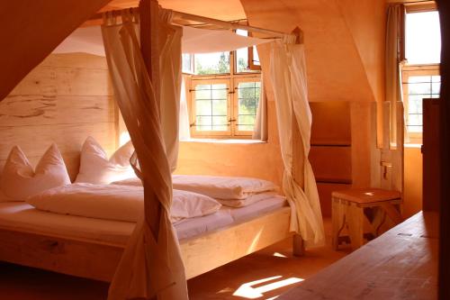 a bed in a room with a window at Hotel San Gabriele in Rosenheim