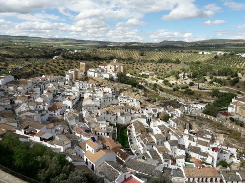 an aerial view of a village with white houses at El Palacete in Setenil
