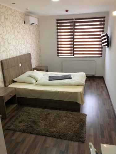 Postel nebo postele na pokoji v ubytování Kovács Hotel Superior