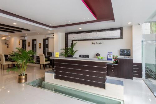 a lobby with a reception desk in a hospital at Treebo Trend Raj Premier - Indiranagar in Bangalore