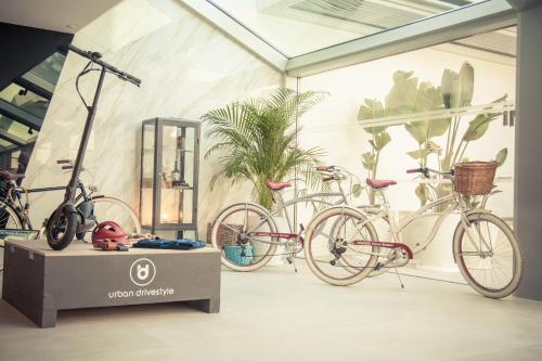 two bikes are on display in a building at INNSiDE by Meliá Palma Bosque in Palma de Mallorca