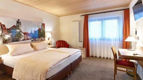 מיטה או מיטות בחדר ב-Gasthof Adler
