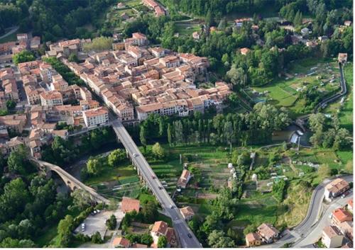an aerial view of a city with houses and roads at Apartamento acogedor in Sant Joan de les Abadesses