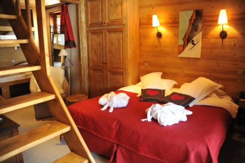 Postel nebo postele na pokoji v ubytování Hôtel Chalet Alpage