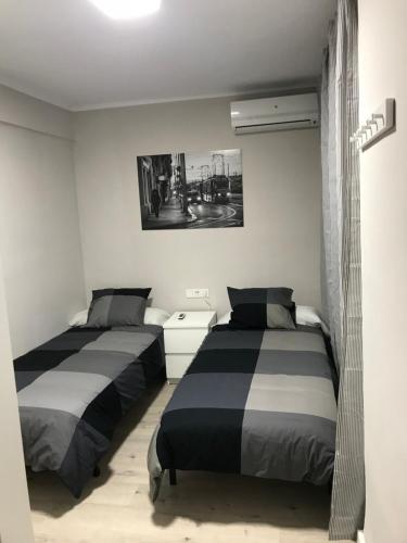 A bed or beds in a room at Corazón de Triana
