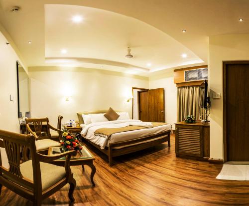Tempat tidur dalam kamar di Hill Palace Hotel & Spa