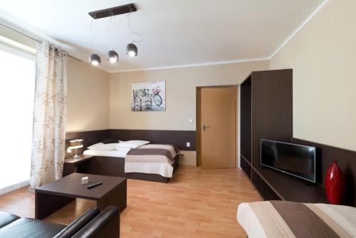Cama o camas de una habitación en B2B Apartments