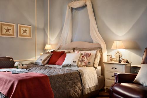 Katil atau katil-katil dalam bilik di Villa Parri Residenza D'epoca