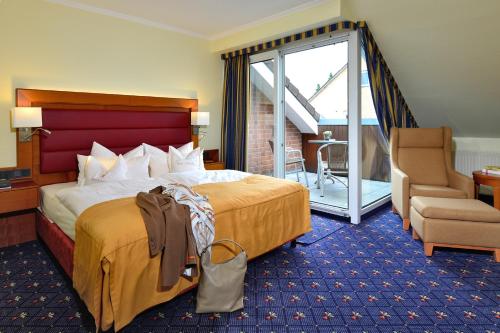 Кровать или кровати в номере Kurhotel Drei Birken