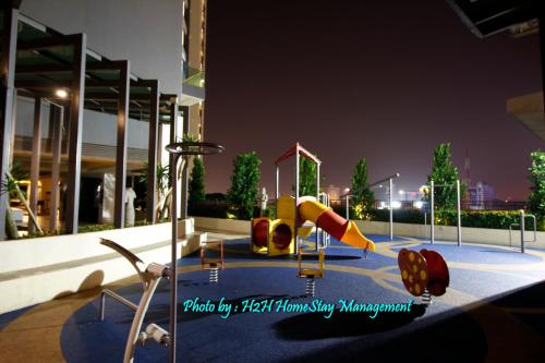 a playground in a building at night with at H2H - Swiss Home - Majestic Ipoh in Ipoh