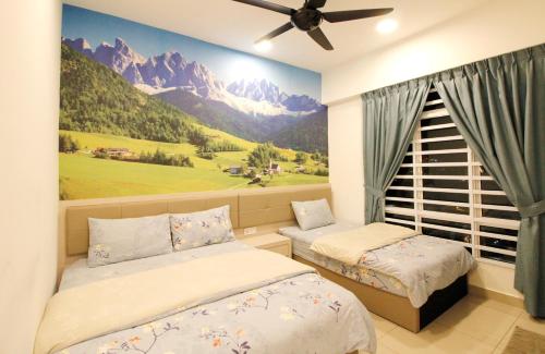 a bedroom with two beds and a window with mountains at H2H - Swiss Home - Majestic Ipoh in Ipoh