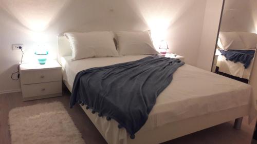 Ένα ή περισσότερα κρεβάτια σε δωμάτιο στο Apartment Sano