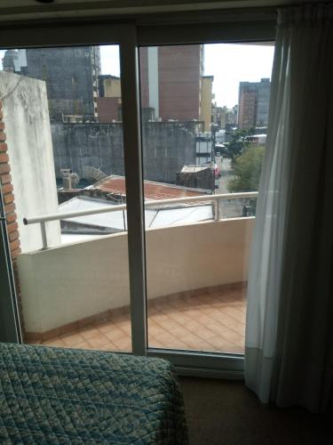a view of a balcony from a bedroom window at Departamento Céntrico in Rosario