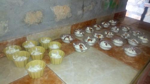 a group of cups sitting on top of a counter at Auberge Camping BOUGAFER Tamtetoucht in Tamtetoucht