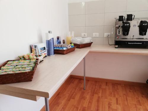 a kitchen counter with baskets of food on it at B&B Altamarea in Marina di Schiavonea