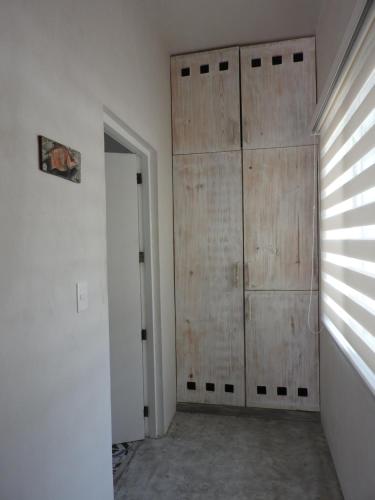 an empty room with a closet and a door at Villas H2O in Tulum