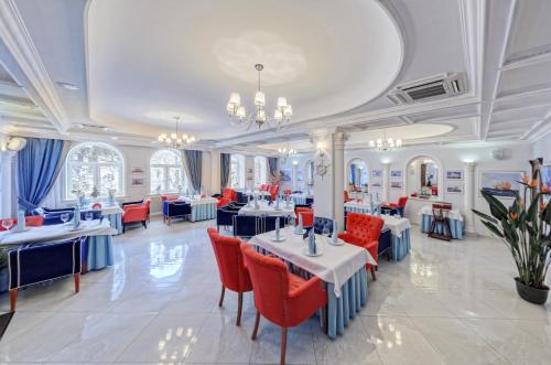 a large room filled with tables and chairs at Bristol Spa-Hotel in Pyatigorsk