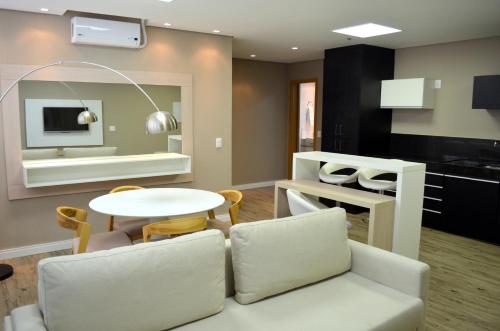 a living room with a couch and a table at Ville Celestine Hotel in Belo Horizonte