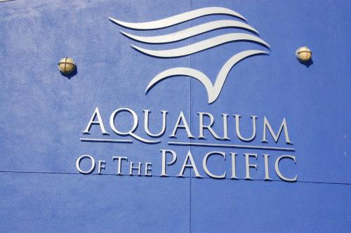 a sign for aauvation of the pacific on a building at Beacon Motel in Long Beach