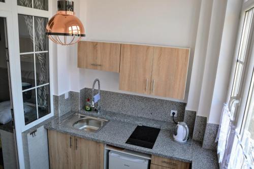 Η κουζίνα ή μικρή κουζίνα στο Apartamenty pod Jedynka - Jednosci Narodowej 3/1