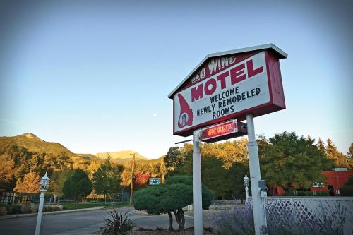 a motel sign on the side of a road at Red Wing Motel in Manitou Springs