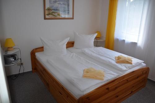 Tempat tidur dalam kamar di Villa Sabinium Appartement 1 und 4
