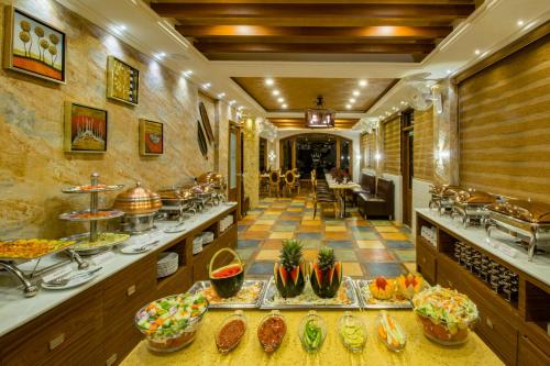 a restaurant with a buffet of food on display at Crown Valley Thekkady in Thekkady