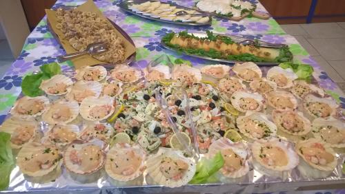 a table with a bunch of food on it at Hotel Tivoli in Misano Adriatico