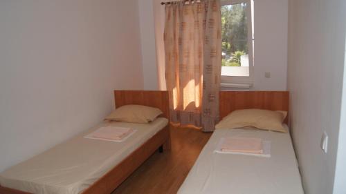 Säng eller sängar i ett rum på Hotel Sharmat
