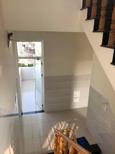 a staircase in a house with a glass door at Nguyễn Kim Motel in Long Hai