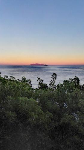 a view of the ocean at sunset from a beach at Alivi in Bastia