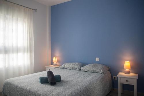 a bedroom with a bed with a stuffed animal on it at Fuerteventura Park in Costa de Antigua